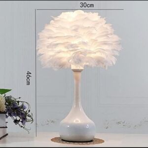 lampara de mesa con  plumas blancas